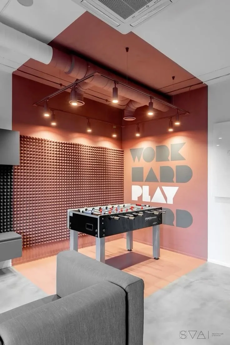 Company break room with a foosball table